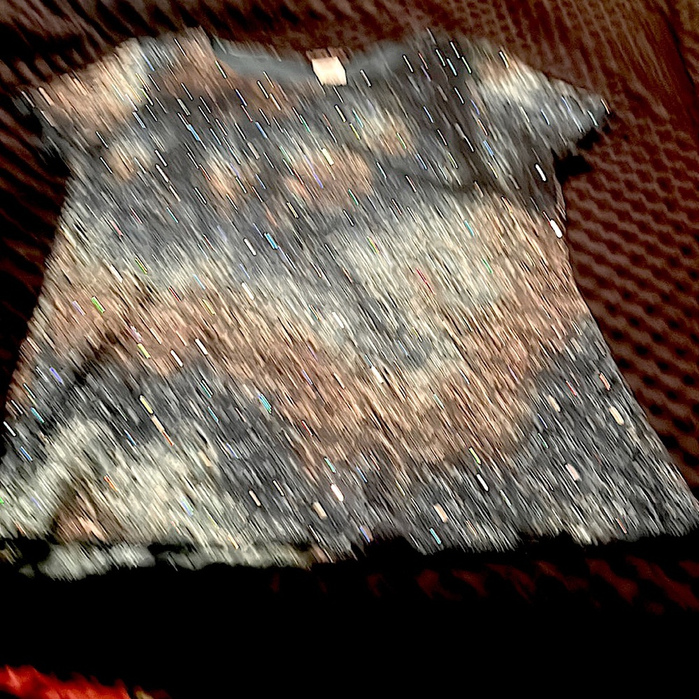 This top is stretchy and comfortable with sequins all over